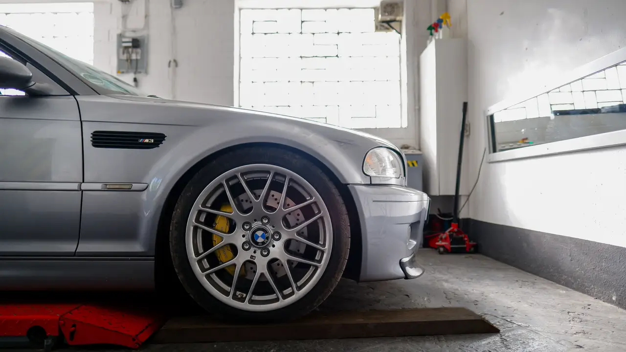 Performance car on a rolling road inside a workshop